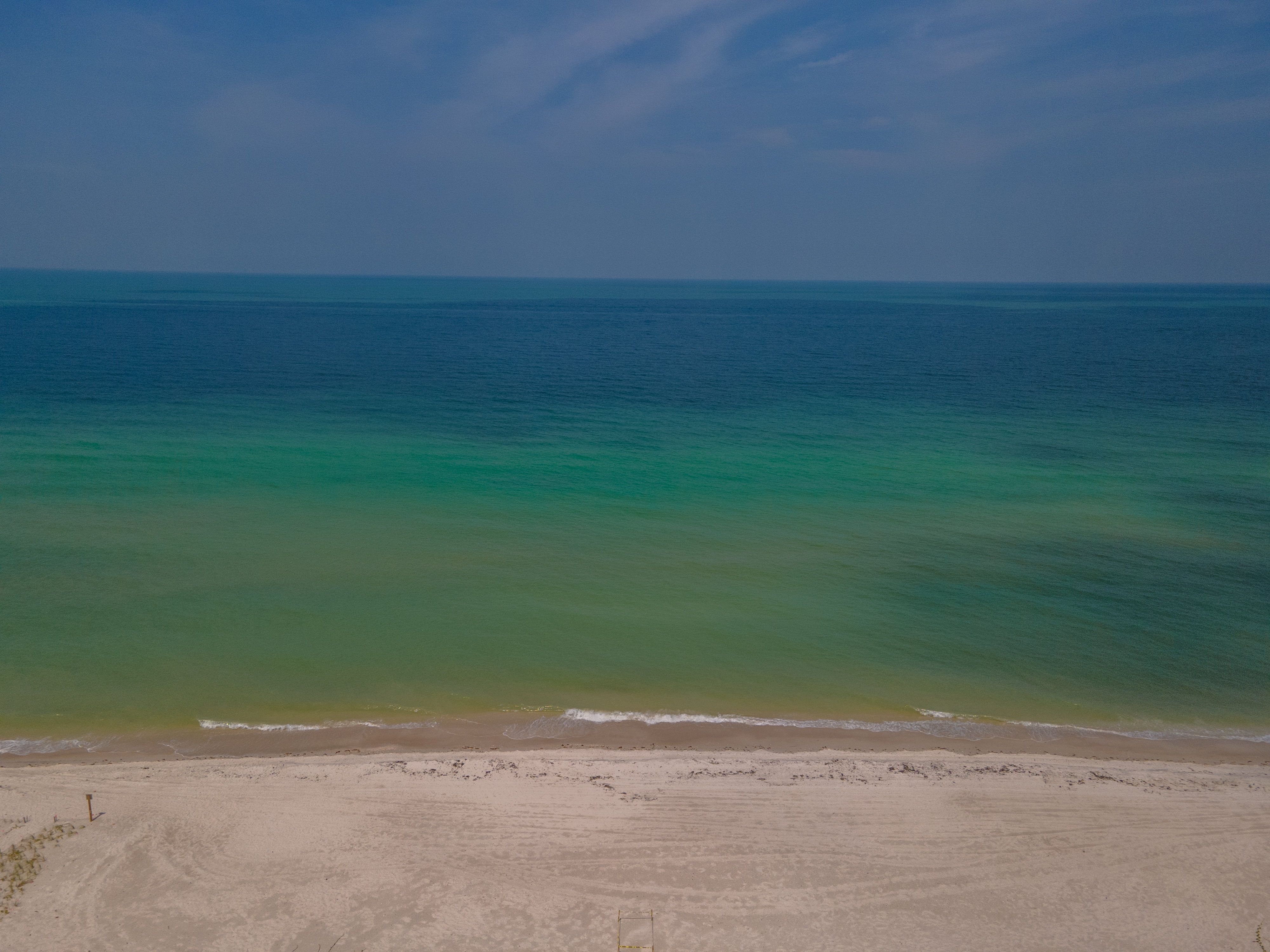Turquoise Gulf water and white-sand beach