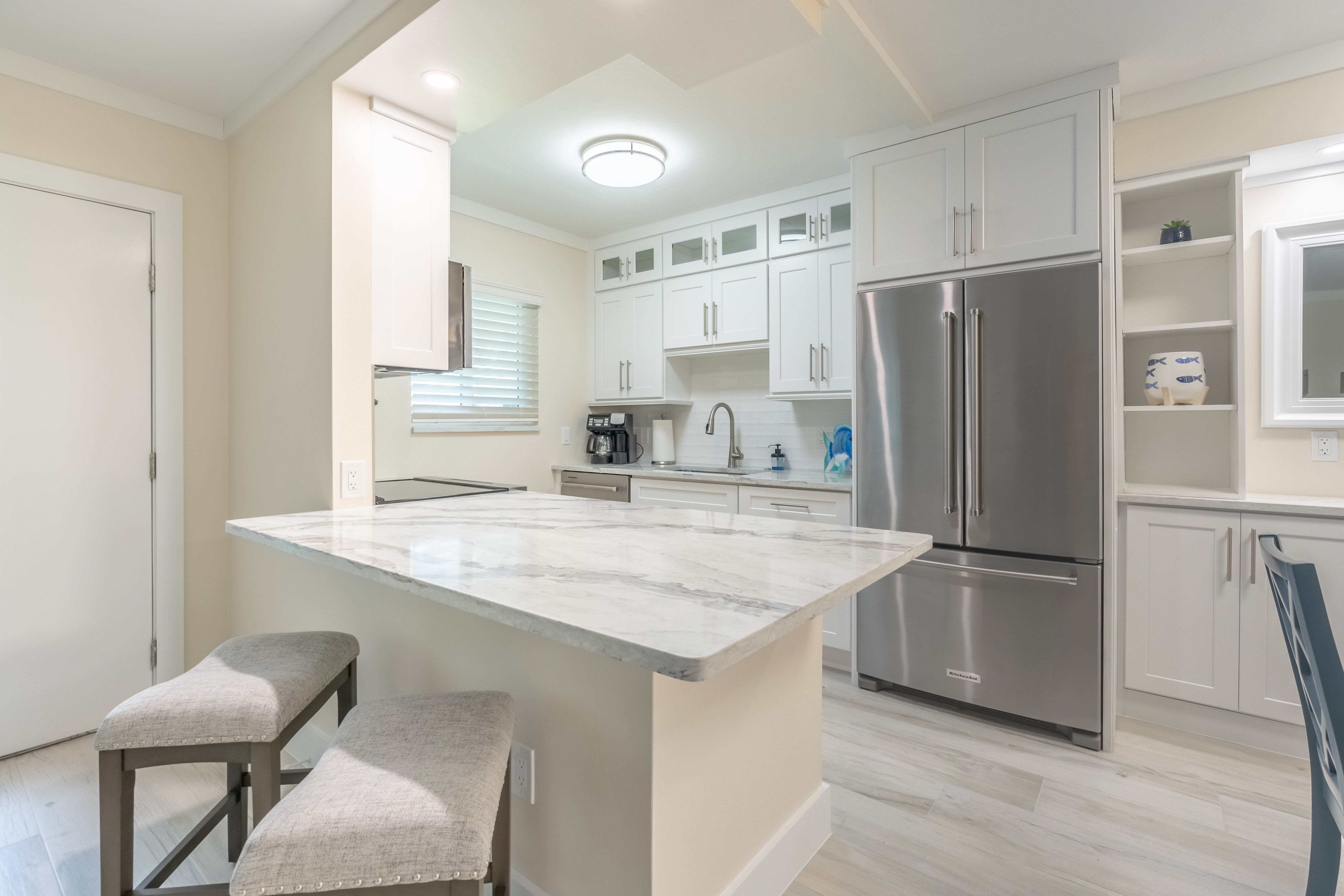 Kitchen with stainless appliances and marble island