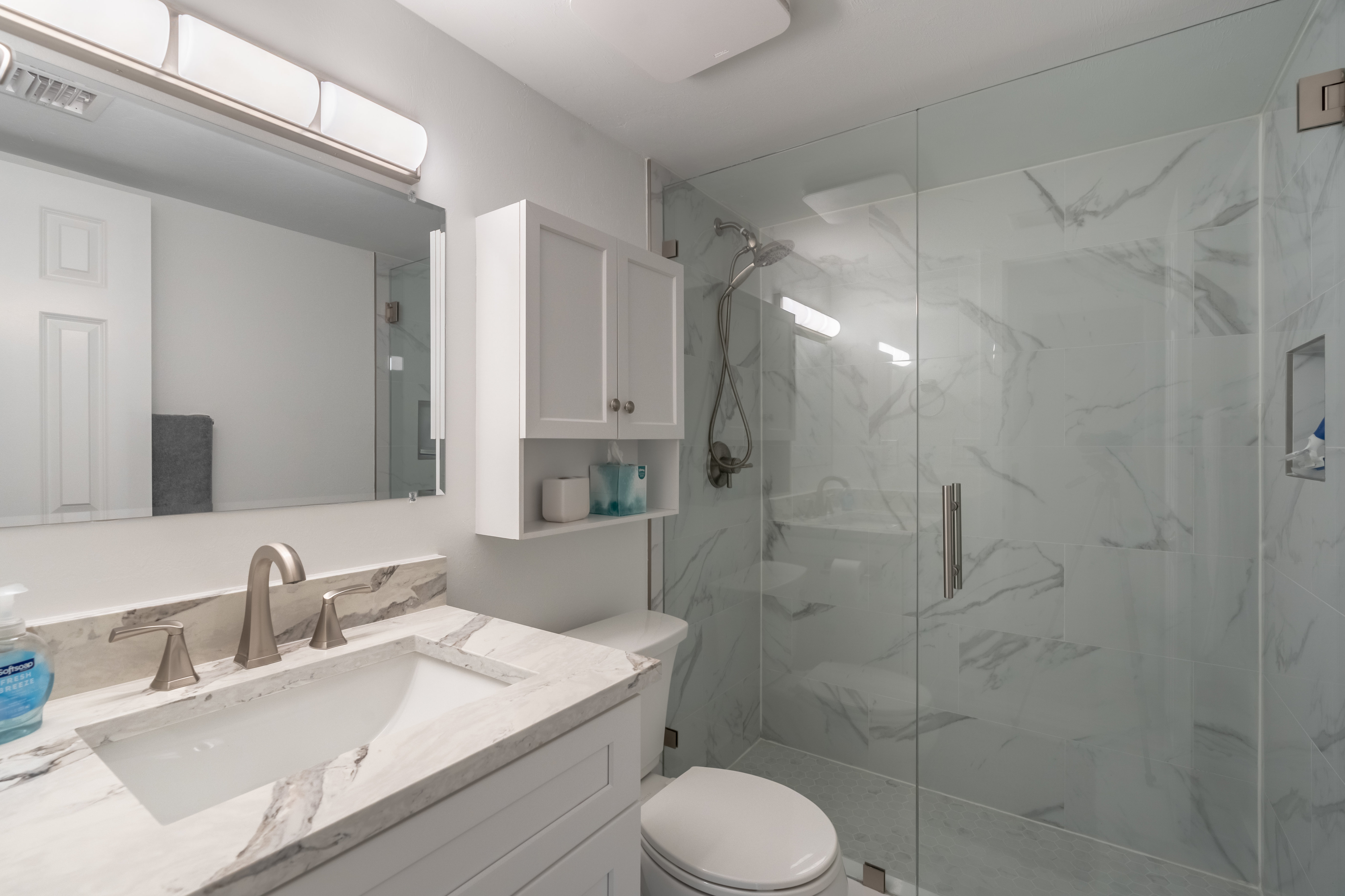 Renovated bathroom with glass shower